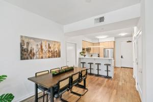 a kitchen and dining room with a table and chairs at Beverly Grove Chic City Oasis 2 BR Apt with Den 138 in Los Angeles +38 photos