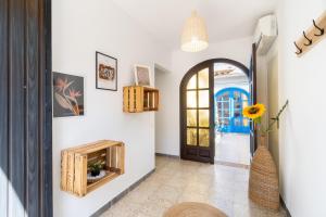a hallway with a fireplace and a door at Cambrils Beach - 8 min to Beach - AC - WiFi - Terrace - 8 Guests in Cambrils