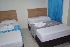 Voodi või voodid majutusasutuse Hotel Real del Valle toas