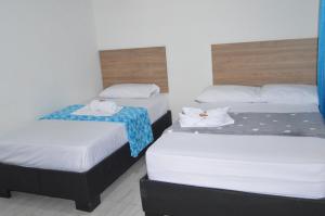 Voodi või voodid majutusasutuse Hotel Real del Valle toas