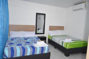 Voodi või voodid majutusasutuse Hotel Real del Valle toas