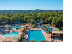 an aerial view of a resort with a swimming pool at Bien être en 5 étoiles au cœur du sud Ardèche, vignobles et rivières in Lagorce