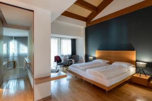 Postel nebo postele na pokoji v ubytování Grand Hotel Terme Di Comano