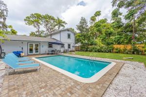 a swimming pool in the backyard of a house at Private Heated Pool - Arcade - Pets - 2 King Beds in Bradenton