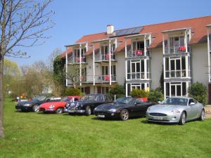 a row of cars parked in front of a building at AngerResidenz in Zwiesel