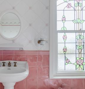 a bathroom with a sink and a window at Magnificent house with Harbour view - Ramsgate in Ramsgate