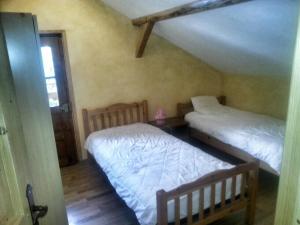 Un pat sau paturi într-o cameră la Refuge Du Linga