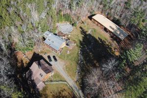 an aerial view of a house in a field at The Northern Quarters in Wardsboro