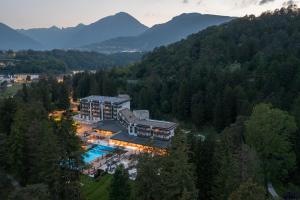 an aerial view of a house in the mountains at Grand Hotel Terme Di Comano in Comano Terme