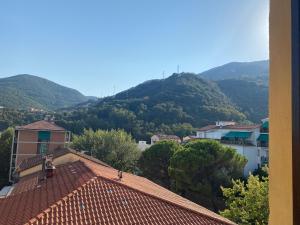 a view of a town with mountains in the background at DA ARMÀ in La Spezia