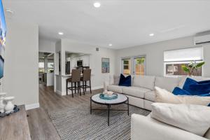 a living room with a couch and a table at Immaculate, Private Home Near Ft. Lauderdale Beach in Fort Lauderdale