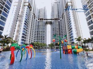 a water park in front of some tall buildings at Atlantis Melaka I 5-11pax I 5min JonkerSt By Alviv Management in Melaka