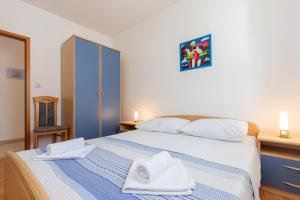 Posteľ alebo postele v izbe v ubytovaní Apartmani MW, Plavi apartman