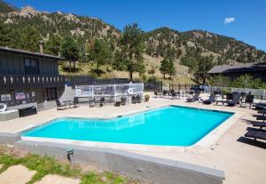 a swimming pool in front of a mountain at Fawn Valley Inn- 278 condo in Estes Park +2 photos
