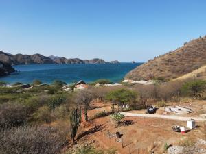 a view of a body of water from a hill at Puro Paraíso Eco Hotel in Taganga