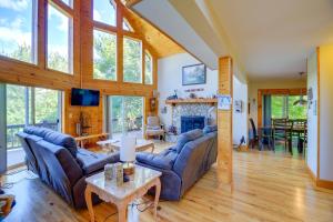 a living room with couches and a fireplace at Piney Creek Cabin with Deck, Grill and Mountain Views! in Piney Creek