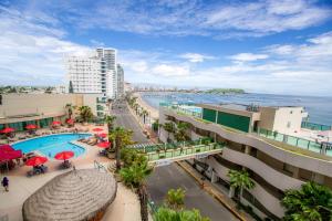 a view of the beach from a building at Hotel Colon Salinas in Salinas