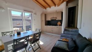 a living room with a table and a couch at REST AND VIEW APARTMENT in Vercana