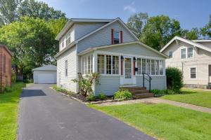 a small white house with a driveway at Welcoming Willoughby Home 1 Mi to Historic Dtwn in Willoughby