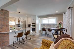 a kitchen and living room with a table and chairs at Welcoming Willoughby Home 1 Mi to Historic Dtwn in Willoughby