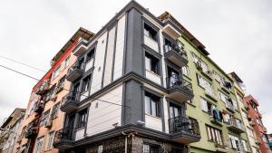 a tall building with balconies on the side of it at CK PALACE Hotel in Istanbul