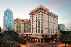 a rendering of a hotel building in a city at Courtyard Austin Downtown/Convention Center in Austin