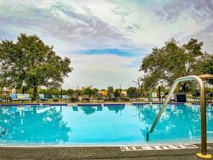 a large blue swimming pool with a slide at Holiday Inn - St Augustine - World Golf, an IHG Hotel in Saint Augustine