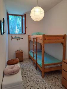 Postel nebo postele na pokoji v ubytování La casa in pineta + 12 fotografií