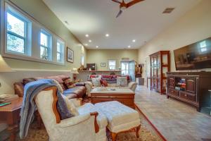 a large living room with couches and a tv at Cascade Cabin Hideaway with Views, half Mi to Lake in Cascade