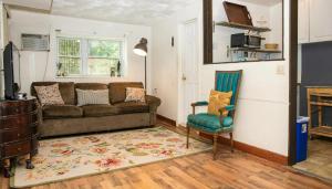 a living room with a couch and a chair at Marvelous 3BR in NYC! in New York