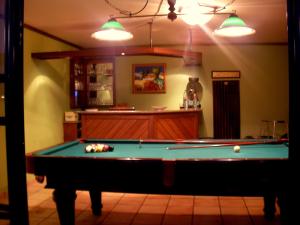 a living room with a pool table in it at Villa São Paulo in Funchal