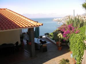 a view of the ocean from a house at Villa São Paulo in Funchal