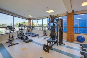 a gym with treadmills and ellipticals in a building at Quality Hotel São Caetano in São Caetano do Sul