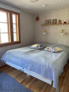 Postel nebo postele na pokoji v ubytování Villa Salajärvi