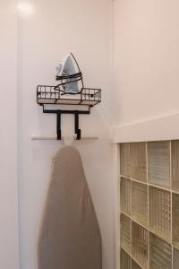 a room with a shelf with a pillow on a wall at 1885 Garden Studio - Historic Heart of Savannah - Pulaski Ward in Savannah