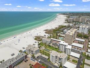 an aerial view of a beach with buildings and the ocean at Island House Beach Resort 14S in Point O'Rocks