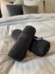 a pair of gray socks on a bed at UNLIMITED - schön & zentral wohnen perfekt für kurze Aufenthalte in Bamberg