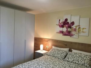 A bed or beds in a room at Home Iseo Lake