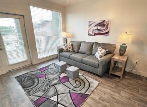 a living room with a couch and a rug at Luxury Condo in the Library Square District in Salt Lake City