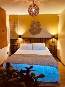 Postel nebo postele na pokoji v ubytování Blumen Hotel