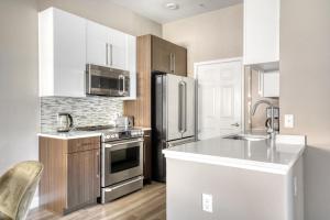 a kitchen with a stainless steel refrigerator and a sink at Sunnyvale 1BR w wd gym pool nr highways SFO-1111 in Sunnyvale