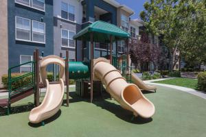 a playground with a slide in front of a building at Sunnyvale 1BR w wd gym pool nr highways SFO-1111 in Sunnyvale