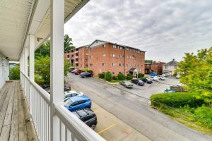 a balcony with a view of a parking lot with cars at Morgantown Apartment Near Hospitals 1 Mi to WVU! in Morgantown