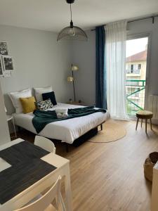 Posteľ alebo postele v izbe v ubytovaní Appartement - cœur de Ramonville