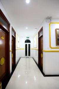 a hallway with two doors and a white floor at KING VILLA QUẢNG NGÃI in Quảng Ngãi
