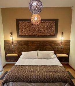 Postel nebo postele na pokoji v ubytování Blumen Hotel