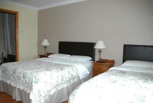 A bed or beds in a room at Quay House