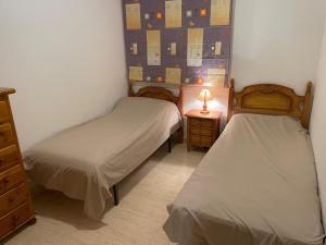 Postel nebo postele na pokoji v ubytování Apartment / Penthouse Mil Palmeras + 17 fotografií