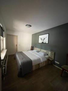 מיטה או מיטות בחדר ב-Huisje 9a