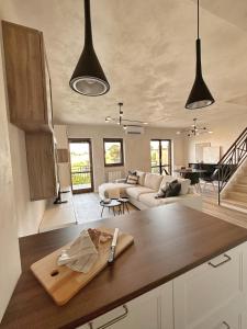 a kitchen with a wooden cutting board on a counter at Par71 - Marco Simone golf club Rome in Marco Simone